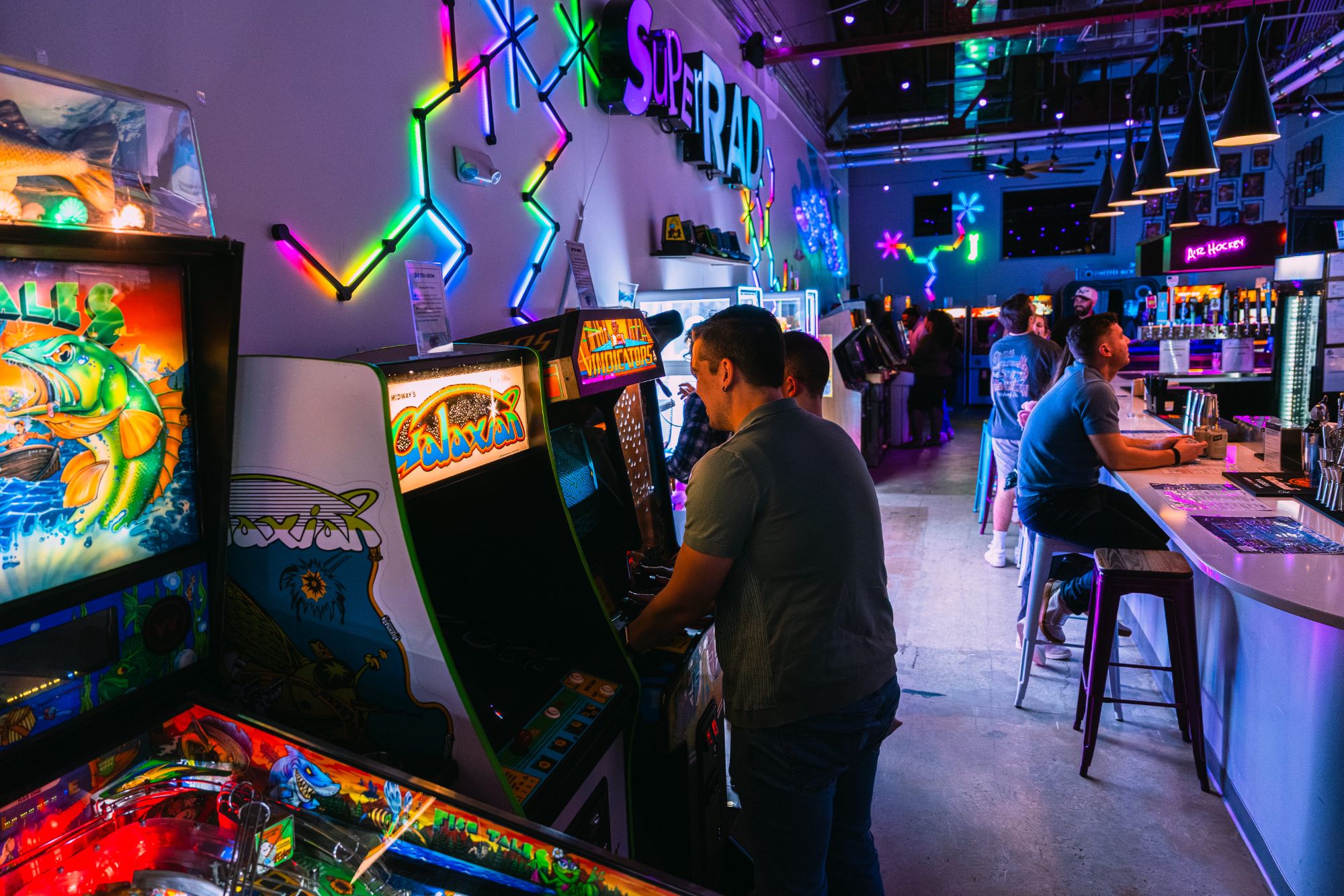 Playing Galaga at Super Rad retro arcade bar Raleigh