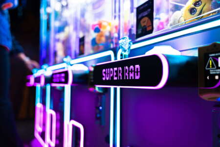 Retro arcade bar in Raleigh with classic arcade cabinets and neon lights
